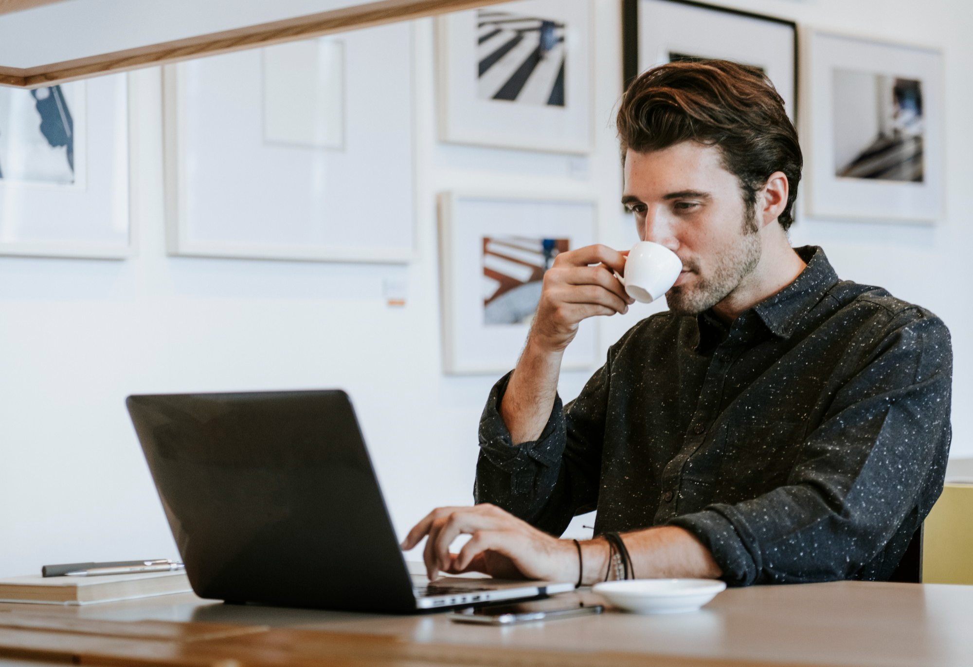 man-sipping-coffee-while-working (2)